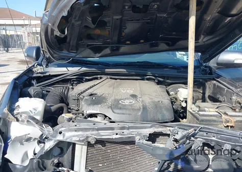 2013 Toyota Tacoma Base V6 z USA, uszkodzony, nr VIN 3TMLU4EN2DM129101